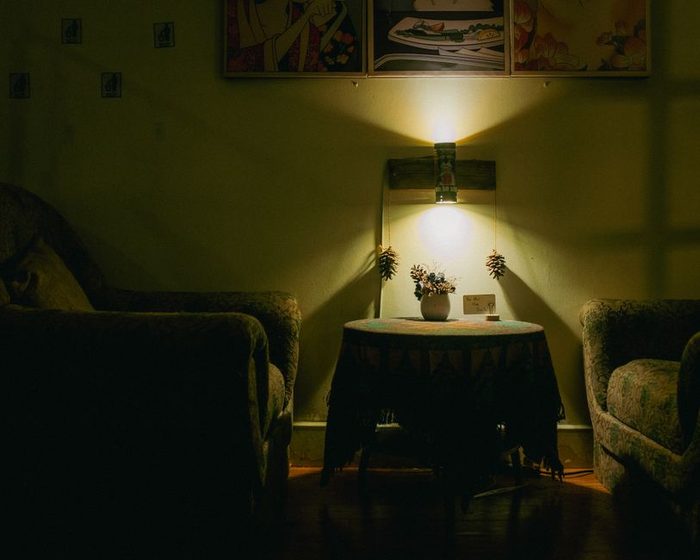 A lamp being dimmed on a tidy desk at the end of the day